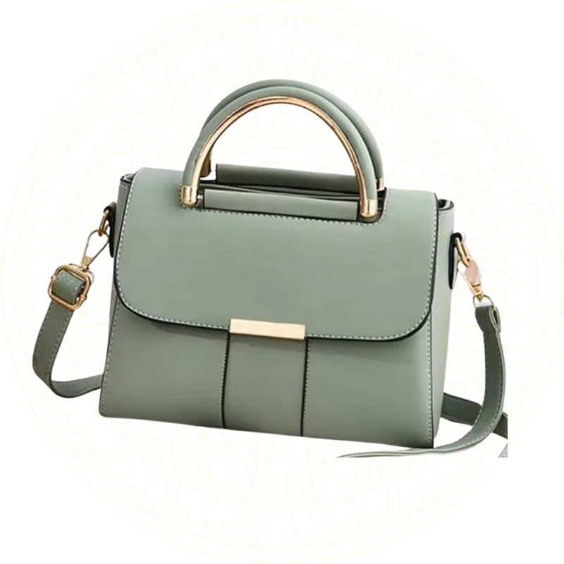 Bolsa feminina verde claro com alça superior dourada e design flap minimalista, da coleção Zéllora Coutore – elegância estruturada em couro sintético.

